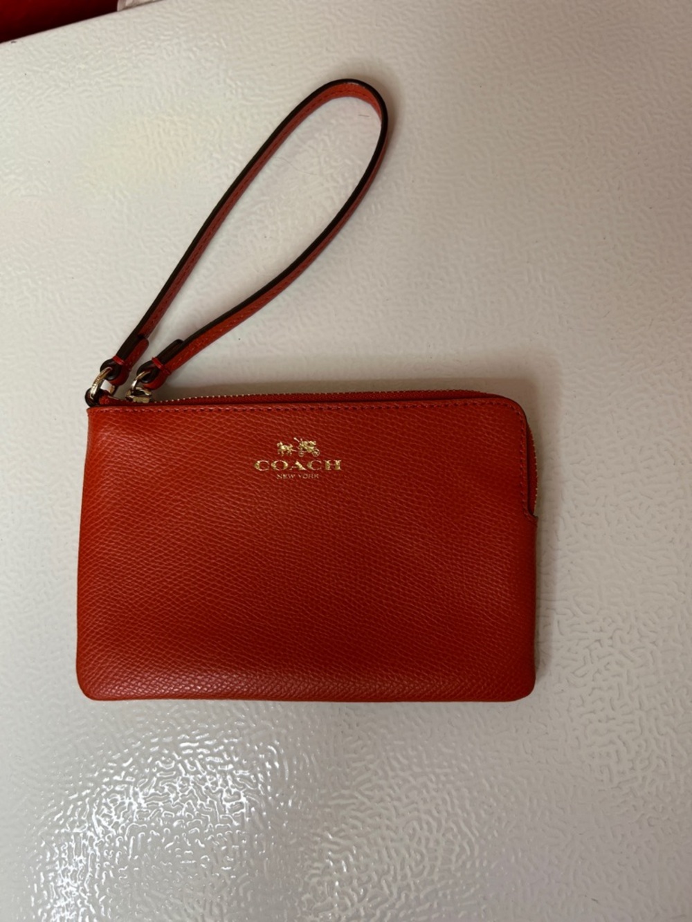 Coach Orange-Red Leather Wristlet with Gold Logo